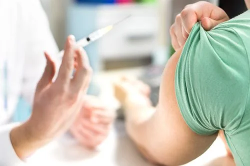 A pharmacist administering an immunization